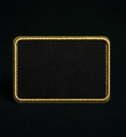 A sponsor patch with gold embroidered trim and nothing on it.